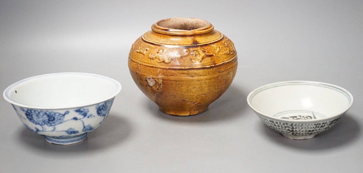 Two Chinese Ming blue and white bowls and a straw glazed jar of Martaban type - tallest 13cm